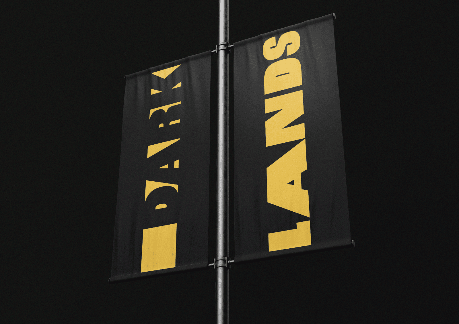 Two sided street post banner, at night. Two black banners with the words Dark on the left and Lands on the right.