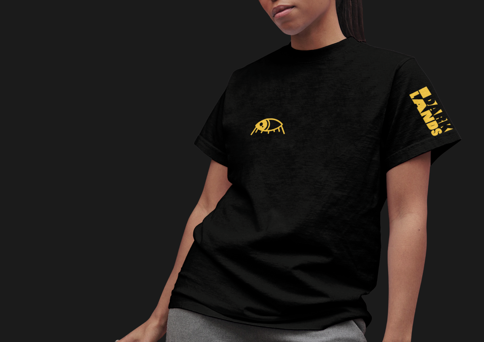 Black festival shirt with yellow graphics.